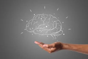 Portada del artículo. Dibujo de cerebro flotando encima de una mano